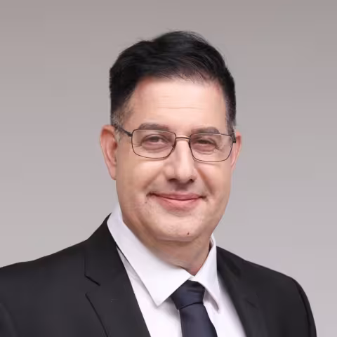 Professional headshot of Micah Adler