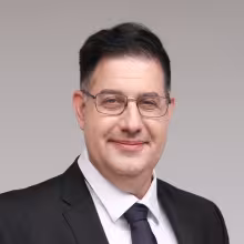 Professional headshot of Micah Adler